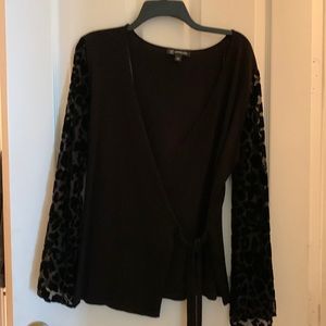 Black wrap sweater with animal print sleeves NEVER WORN tags are still on